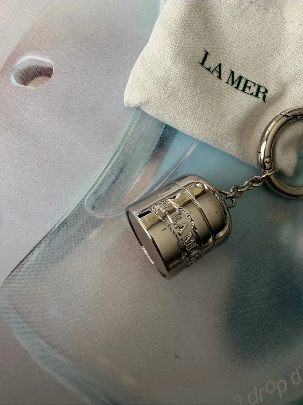 La Mer Silver Tone bag charm / Keychain with Drawstring Pouch
